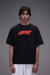 Male model wearing Boxy fit oversized Black Tee with Formula 1 logo in red.